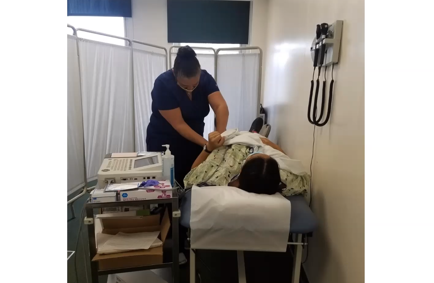 Medical student working with patient